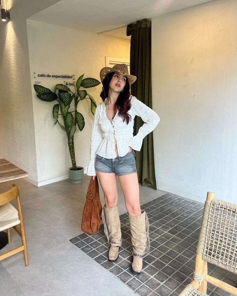 Edgy low-rise double-button denim shorts—hip-hugging hot pants.