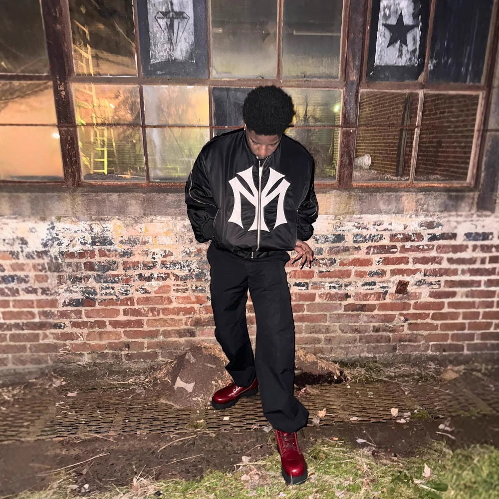 oose-fit sweatshirt with multi-zipper design and letter embroidery.