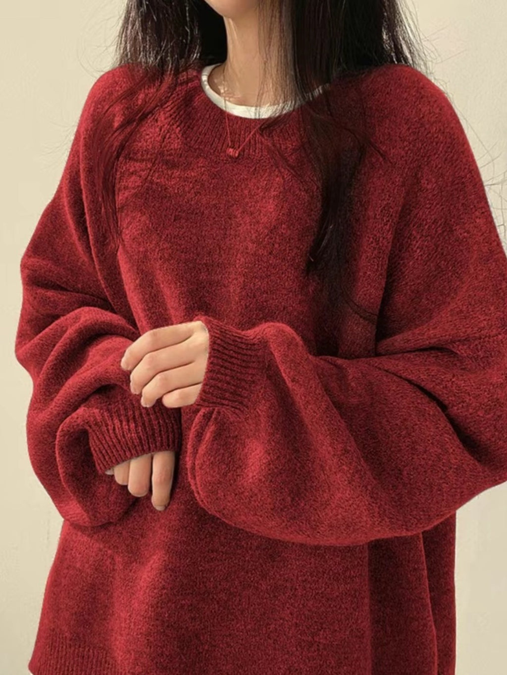 Solid-color, loose-fit, long-sleeve knit pullover with side slits