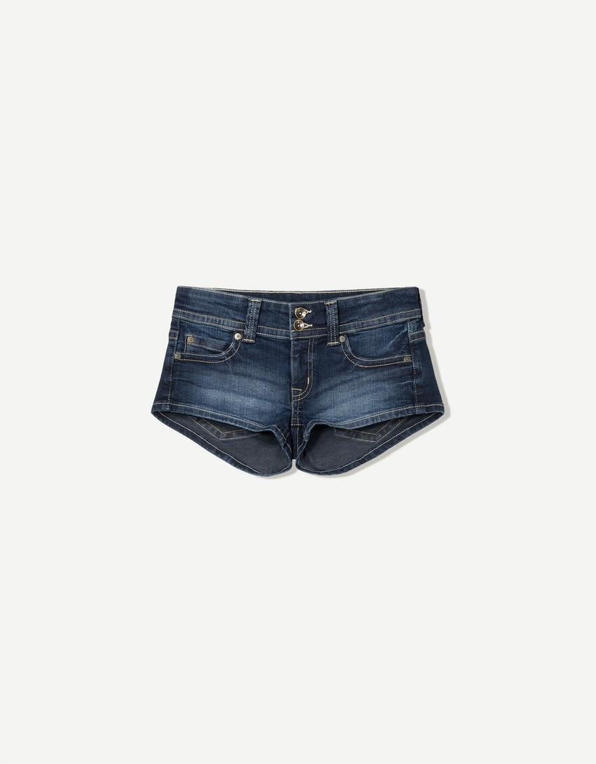Edgy low-rise double-button denim shorts—hip-hugging hot pants.