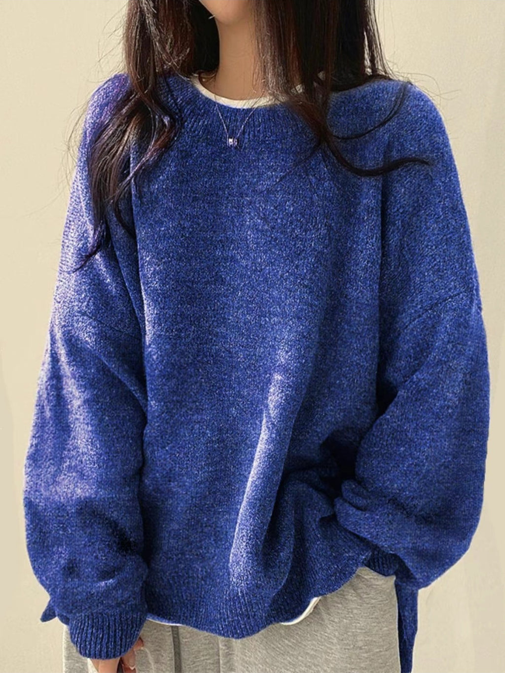 Solid-color, loose-fit, long-sleeve knit pullover with side slits
