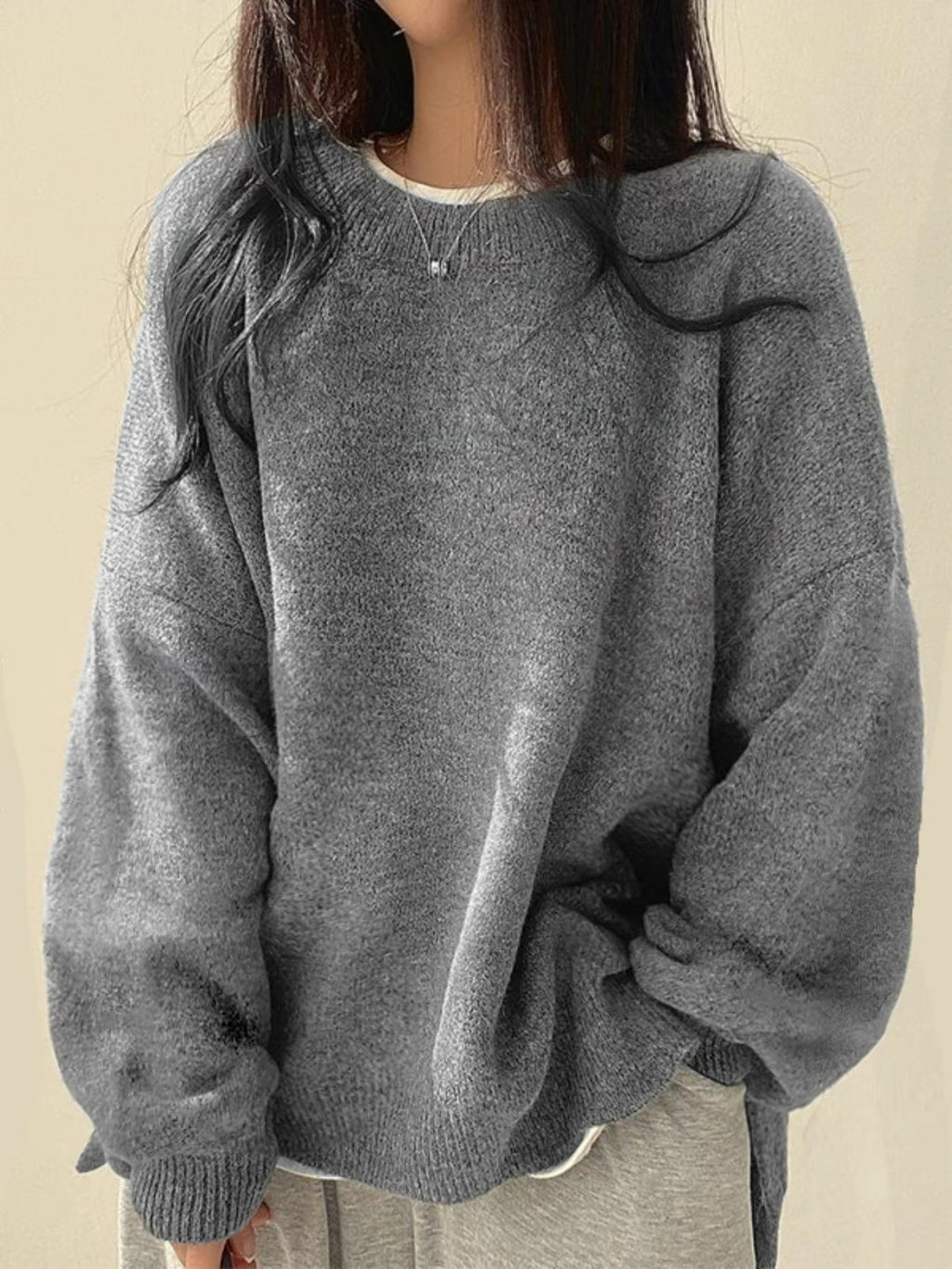 Solid-color, loose-fit, long-sleeve knit pullover with side slits
