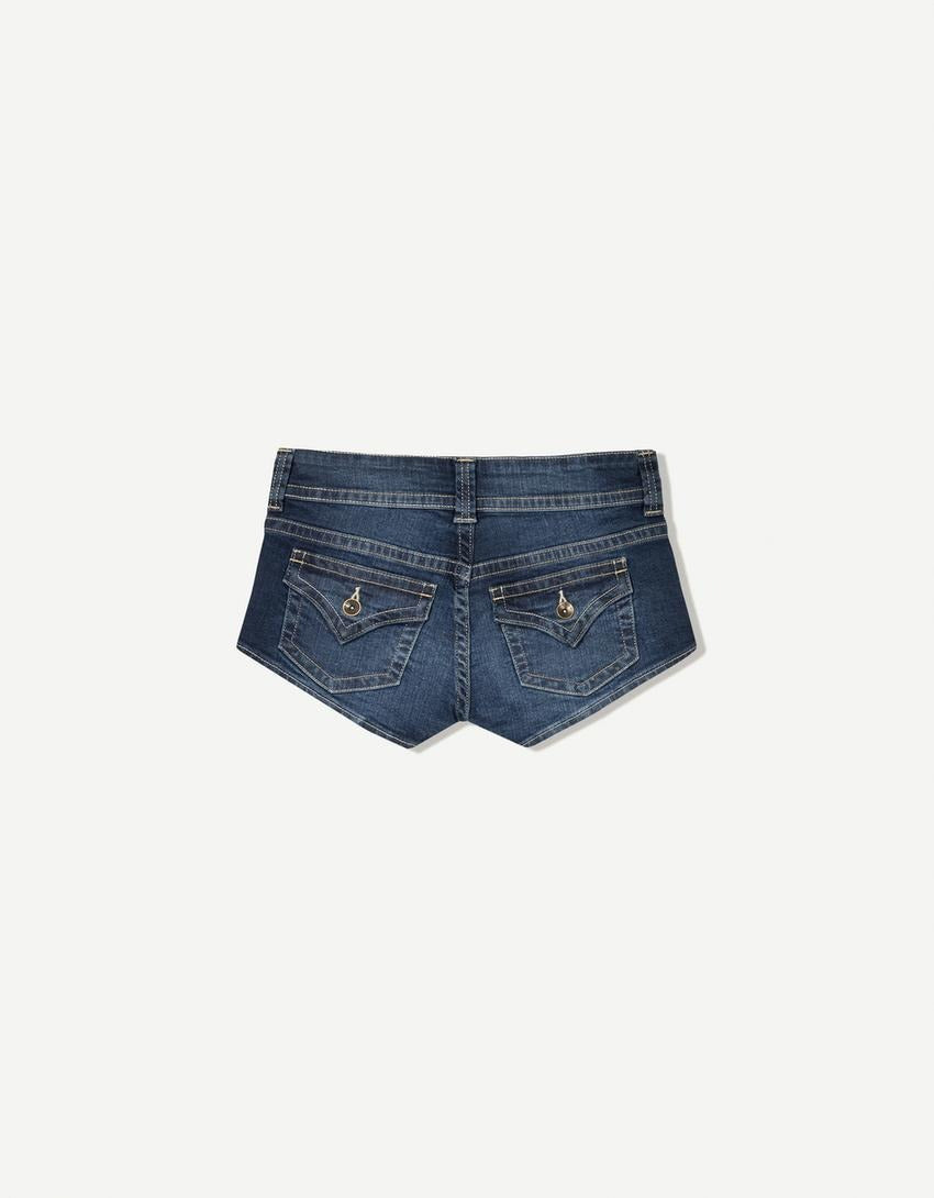 Edgy low-rise double-button denim shorts—hip-hugging hot pants.