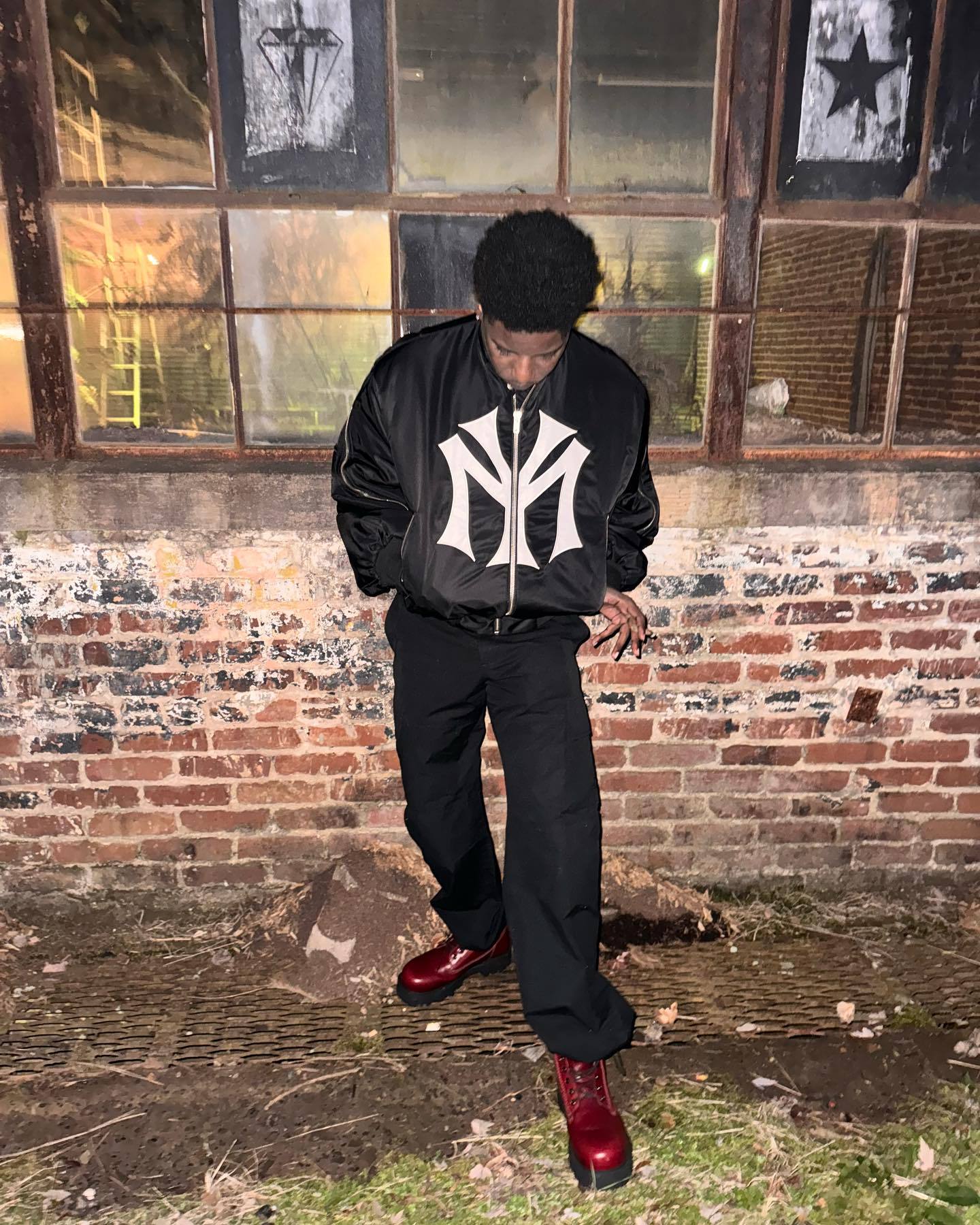 oose-fit sweatshirt with multi-zipper design and letter embroidery.