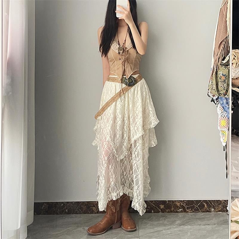 Bohemian-style high-waisted lace maxi skirt with a wavy hem.