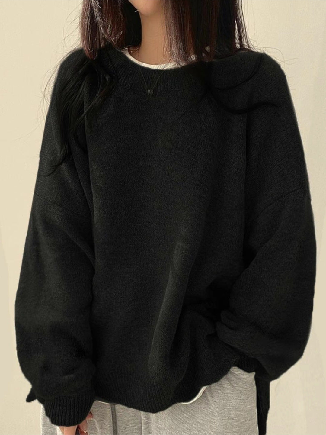 Solid-color, loose-fit, long-sleeve knit pullover with side slits