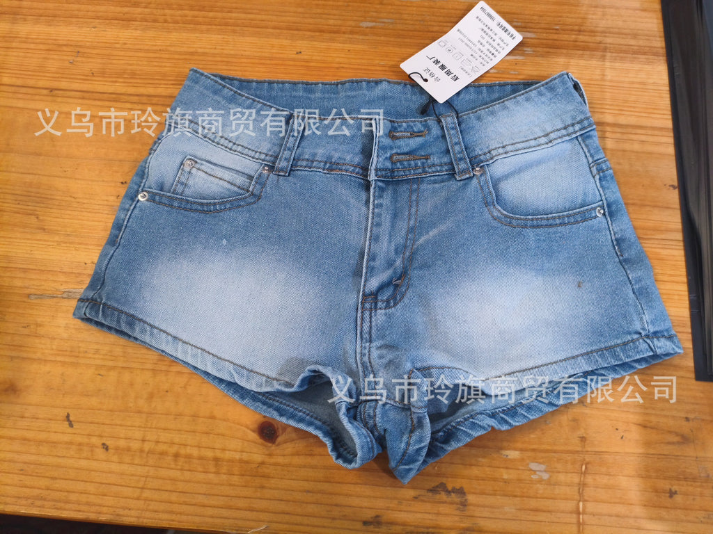 Edgy low-rise double-button denim shorts—hip-hugging hot pants.