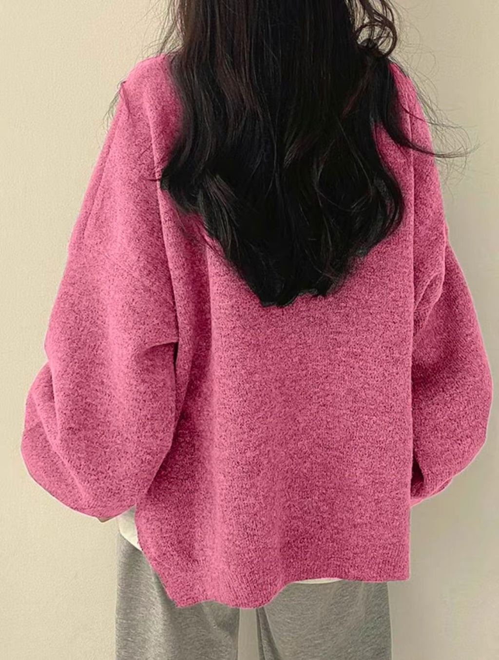Solid-color, loose-fit, long-sleeve knit pullover with side slits