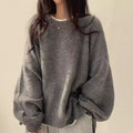 Solid-color, loose-fit, long-sleeve knit pullover with side slits