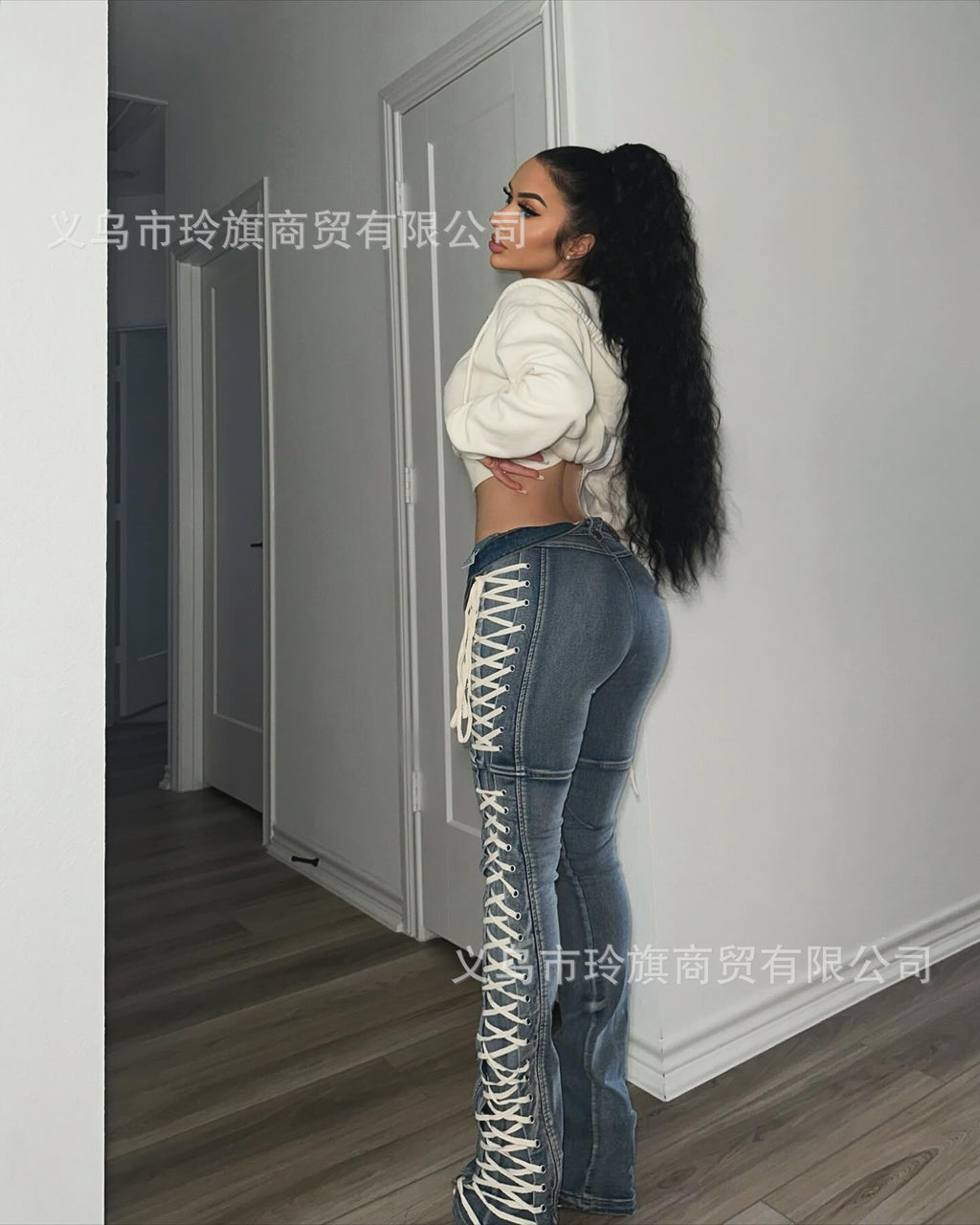 Y2K-style high-waisted, slim-fit lace-up bootcut jeans