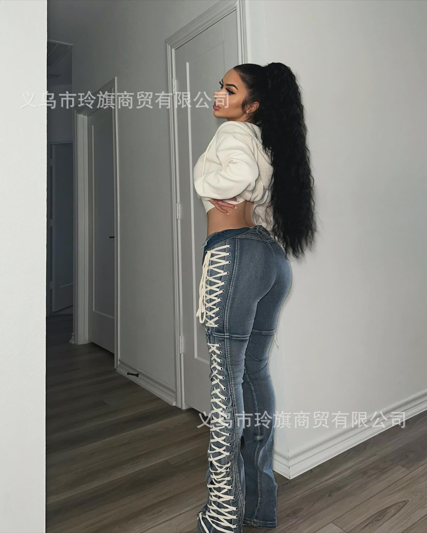 Y2K-style high-waisted, slim-fit lace-up bootcut jeans