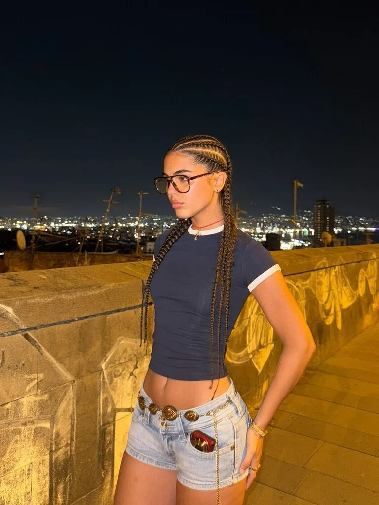 Edgy low-rise double-button denim shorts—hip-hugging hot pants.