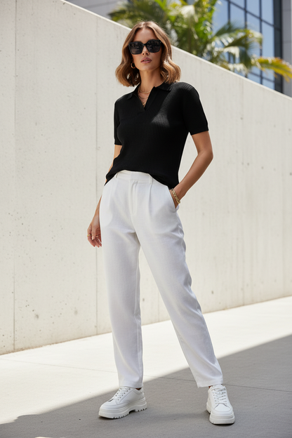 Model wearing black knit polo shirt - summer casual style